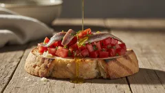 Tutti i trucchi per una bruschetta croccante con acciughe e pomodori